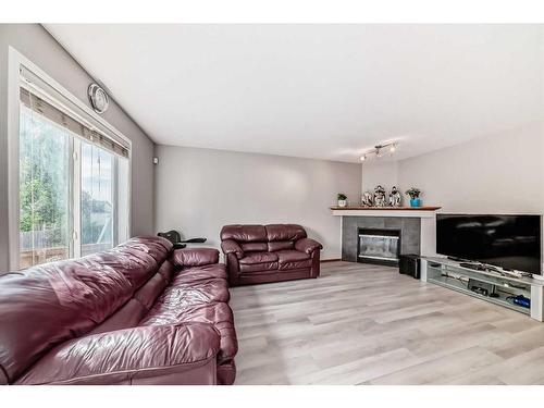 20 Panatella Drive Nw, Calgary, AB - Indoor Photo Showing Living Room With Fireplace