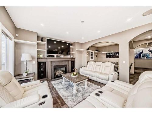 286 Taravista Drive Ne, Calgary, AB - Indoor Photo Showing Living Room With Fireplace