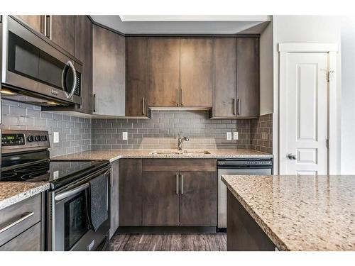 415 Cranford Walk Se, Calgary, AB - Indoor Photo Showing Kitchen With Upgraded Kitchen