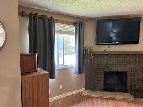 175 Templehill Drive Ne, Calgary, AB - Indoor Photo Showing Living Room With Fireplace