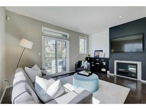 221 Ascot Circle Sw, Calgary, AB - Indoor Photo Showing Living Room With Fireplace