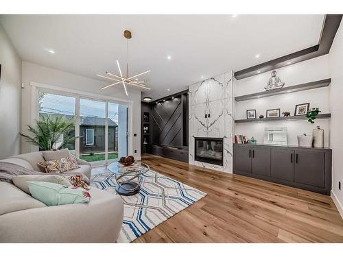 1710 29 Street Sw, Calgary, AB - Indoor Photo Showing Living Room With Fireplace