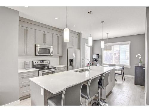 60-111 Rainbow Falls Gate, Chestermere, AB - Indoor Photo Showing Kitchen With Stainless Steel Kitchen With Double Sink With Upgraded Kitchen