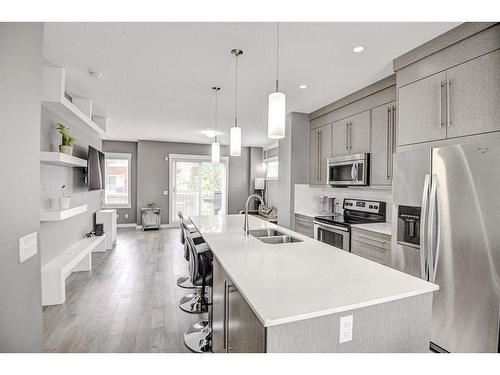 60-111 Rainbow Falls Gate, Chestermere, AB - Indoor Photo Showing Kitchen With Stainless Steel Kitchen With Double Sink With Upgraded Kitchen