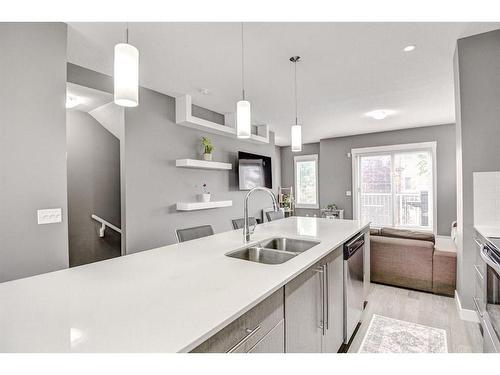 60-111 Rainbow Falls Gate, Chestermere, AB - Indoor Photo Showing Kitchen With Double Sink With Upgraded Kitchen