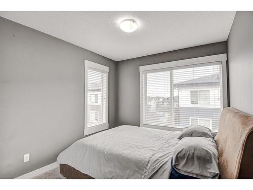 60-111 Rainbow Falls Gate, Chestermere, AB - Indoor Photo Showing Bedroom