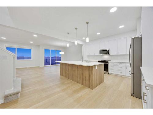 907 Langholm Drive Se, Airdrie, AB - Indoor Photo Showing Kitchen With Upgraded Kitchen