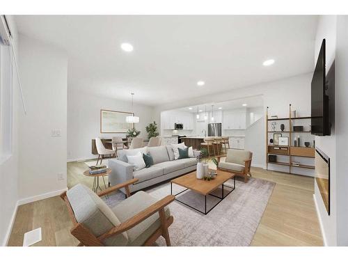 907 Langholm Drive Se, Airdrie, AB - Indoor Photo Showing Living Room