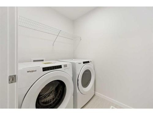 907 Langholm Drive Se, Airdrie, AB - Indoor Photo Showing Laundry Room