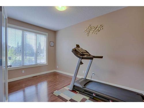 307 Parkmere Green, Chestermere, AB - Indoor Photo Showing Gym Room