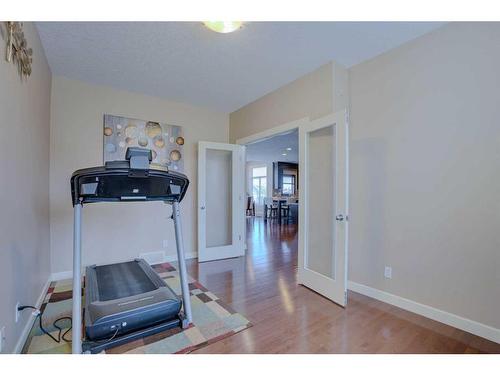 307 Parkmere Green, Chestermere, AB - Indoor Photo Showing Gym Room