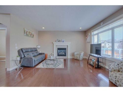 307 Parkmere Green, Chestermere, AB - Indoor Photo Showing Living Room With Fireplace