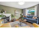 139 Mt Aberdeen Close Se, Calgary, AB  - Indoor Photo Showing Living Room With Fireplace 