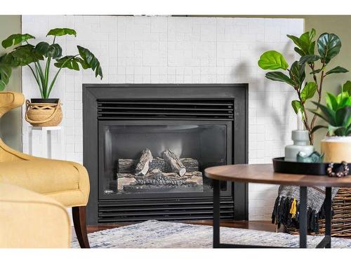 139 Mt Aberdeen Close Se, Calgary, AB - Indoor Photo Showing Living Room With Fireplace