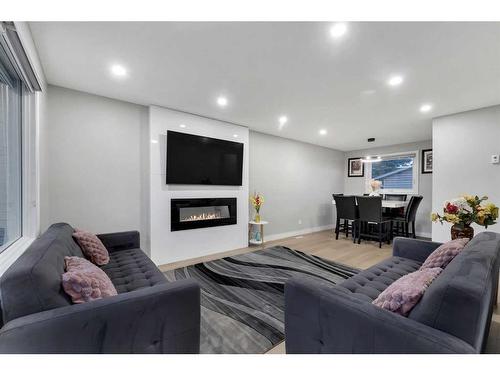 251 Rundlecairn Road Ne, Calgary, AB - Indoor With Fireplace