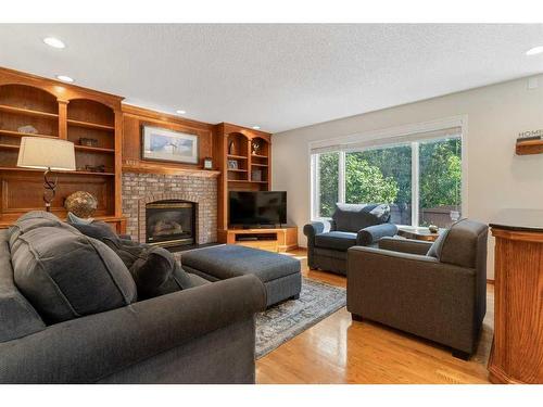 204 Douglas Shore Close Se, Calgary, AB - Indoor Photo Showing Living Room With Fireplace