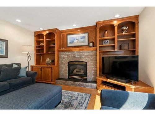 204 Douglas Shore Close Se, Calgary, AB - Indoor Photo Showing Living Room With Fireplace