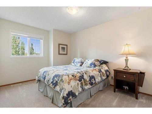 204 Douglas Shore Close Se, Calgary, AB - Indoor Photo Showing Bedroom