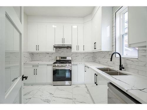 321 Watercrest Place, Chestermere, AB - Indoor Photo Showing Kitchen With Double Sink With Upgraded Kitchen