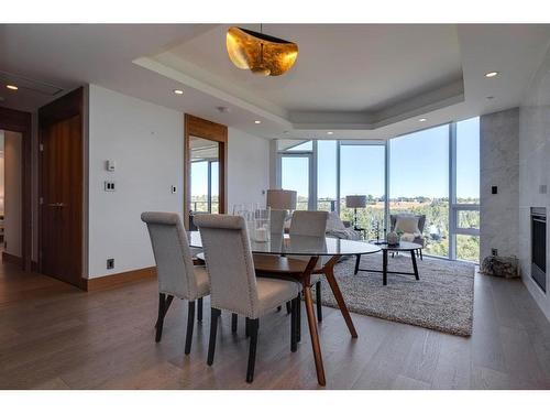 906-738 1 Avenue Sw, Calgary, AB - Indoor Photo Showing Dining Room With Fireplace