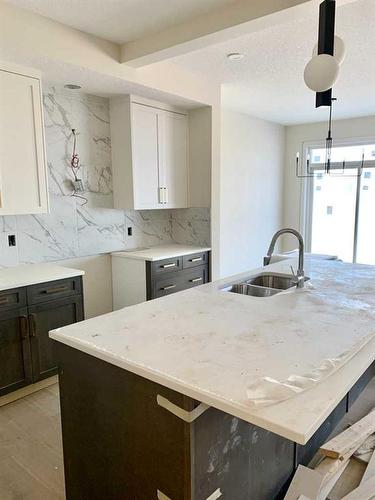 124 Crimson Ridge Place Nw, Calgary, AB - Indoor Photo Showing Kitchen With Double Sink