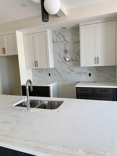 124 Crimson Ridge Place Nw, Calgary, AB - Indoor Photo Showing Kitchen With Double Sink