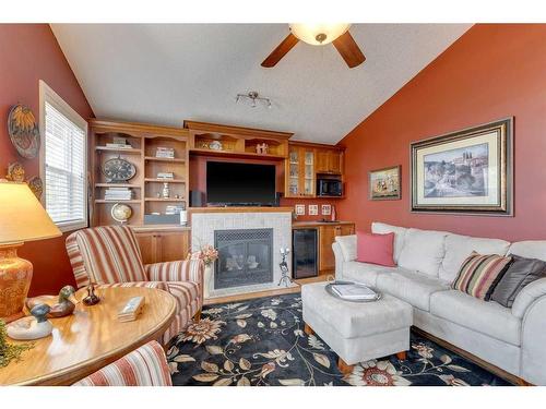 2661 Evercreek Bluffs Way Sw, Calgary, AB - Indoor Photo Showing Living Room With Fireplace