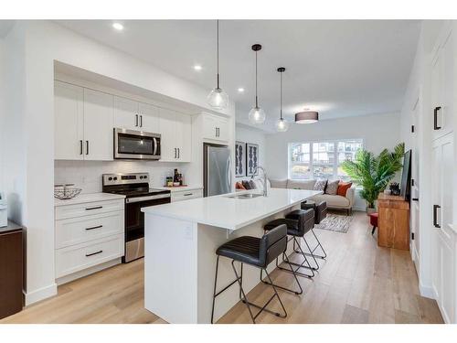 1206-525 River Heights Drive, Cochrane, AB - Indoor Photo Showing Kitchen With Upgraded Kitchen