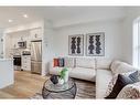 1206-525 River Heights Drive, Cochrane, AB  - Indoor Photo Showing Living Room 