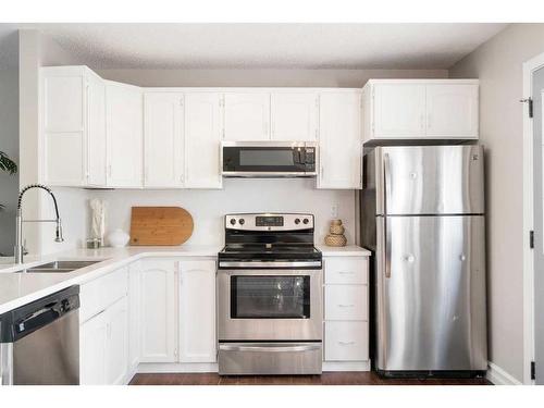 209 Acacia Drive Se, Airdrie, AB - Indoor Photo Showing Kitchen With Double Sink