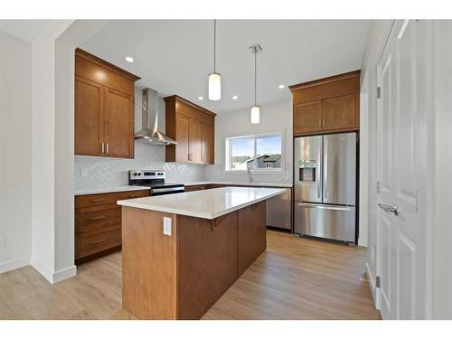 722 Bayview Hill Sw, Airdrie, AB - Indoor Photo Showing Kitchen With Stainless Steel Kitchen With Upgraded Kitchen