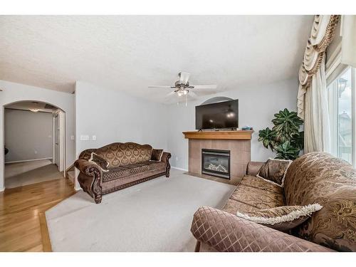 332 Taralake Terrace Ne, Calgary, AB - Indoor Photo Showing Living Room With Fireplace