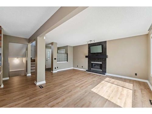 164 Schooner Close Nw, Calgary, AB - Indoor Photo Showing Living Room With Fireplace