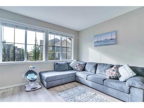 1406-125 Panatella Way Nw, Calgary, AB - Indoor Photo Showing Living Room