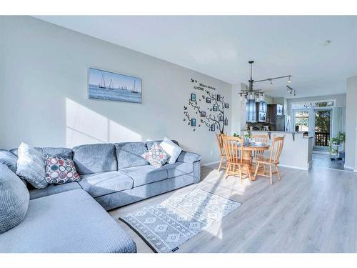 1406-125 Panatella Way Nw, Calgary, AB - Indoor Photo Showing Living Room