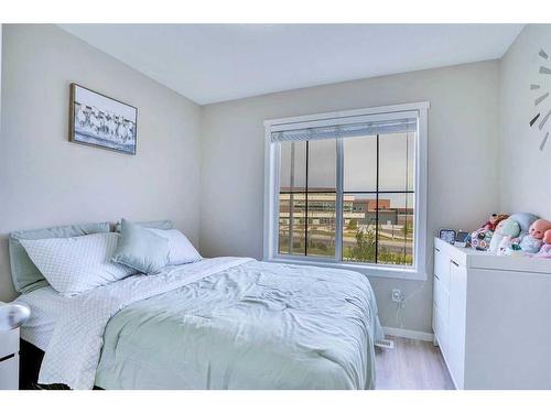 1406-125 Panatella Way Nw, Calgary, AB - Indoor Photo Showing Bedroom