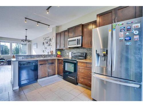 1406-125 Panatella Way Nw, Calgary, AB - Indoor Photo Showing Kitchen