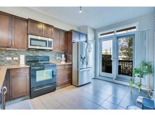 1406-125 Panatella Way Nw, Calgary, AB - Indoor Photo Showing Kitchen