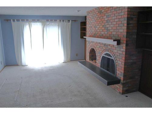 9-1435 96 Avenue Sw, Calgary, AB - Indoor With Fireplace