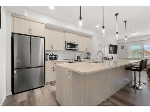 206-40 Carrington Plaza Nw, Calgary, AB - Indoor Photo Showing Kitchen With Stainless Steel Kitchen With Upgraded Kitchen