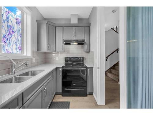 73 Cityside Way Ne, Calgary, AB - Indoor Photo Showing Kitchen With Double Sink