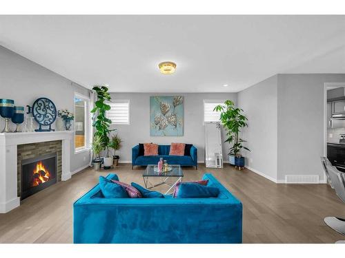 73 Cityside Way Ne, Calgary, AB - Indoor Photo Showing Living Room With Fireplace