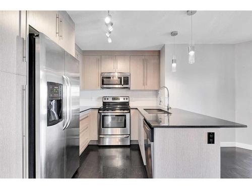 1403-11 Mahogany Row Se, Calgary, AB - Indoor Photo Showing Kitchen With Double Sink