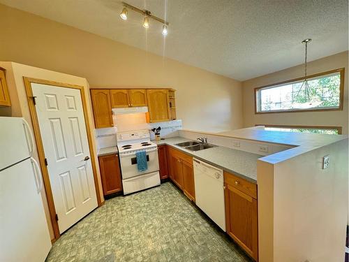 18 Cimarron Meadows Close, Okotoks, AB - Indoor Photo Showing Kitchen With Double Sink