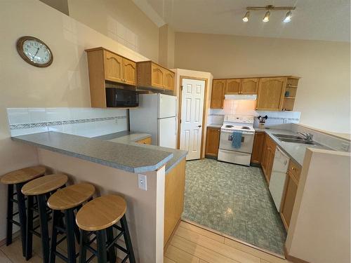 18 Cimarron Meadows Close, Okotoks, AB - Indoor Photo Showing Kitchen With Double Sink