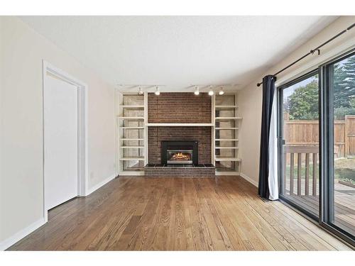 112 Silver Springs Green Nw, Calgary, AB - Indoor Photo Showing Living Room With Fireplace