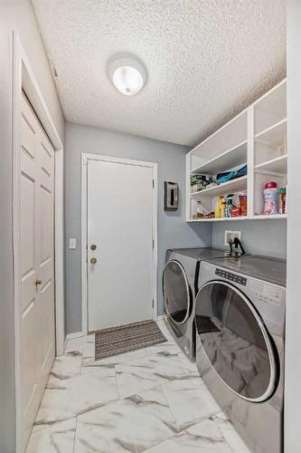 64 Bridlewood Garden Sw, Calgary, AB - Indoor Photo Showing Laundry Room