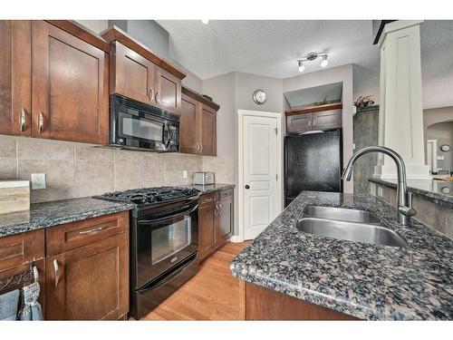 12 Cranleigh Heath Se, Calgary, AB - Indoor Photo Showing Kitchen With Double Sink