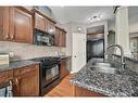 12 Cranleigh Heath Se, Calgary, AB  - Indoor Photo Showing Kitchen With Double Sink 