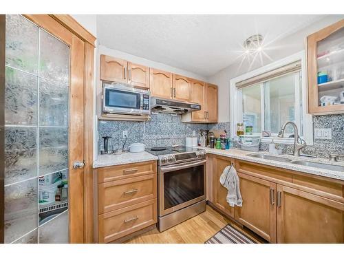 128 Taralake Terrace Ne, Calgary, AB - Indoor Photo Showing Kitchen With Double Sink